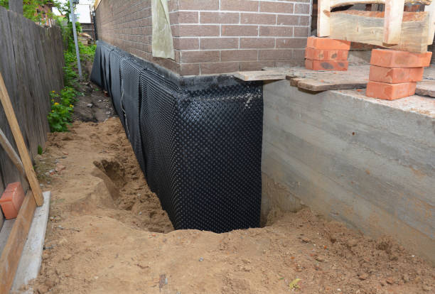 SJ Waterproofing Pros technician performing targeted Vapor Barrier Installation assessment in Berwyn, IL